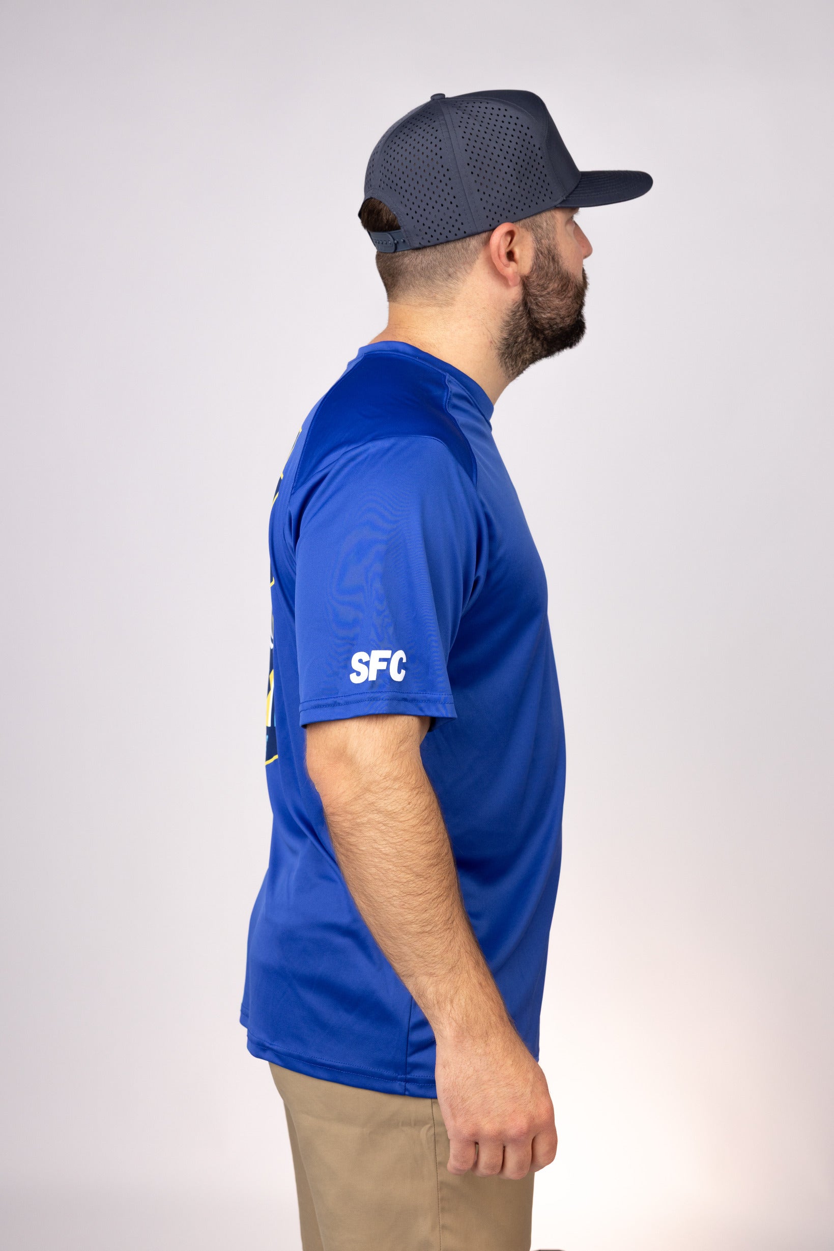 Side view of Royal South Carolina Outcast Performance Tee