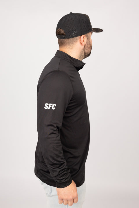 Side view of Black New England Lights Out Quarter Zip